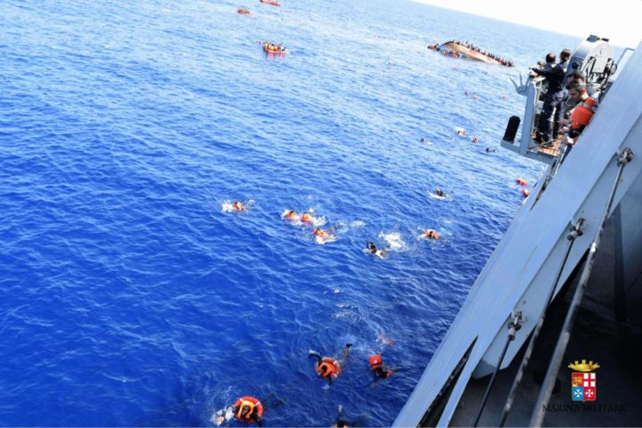 2016-05-25 11:05:22 TOPSHOT - This handout picture released on May 25, 2016 by the Italian Navy (Marina Militare) shows the shipwreck of an overcrowded boat of migrants off the Libyan coast today. At least seven migrants have drowned after the heavily overcrowded boat they were sailing on overturned, the Italian navy said. The navy said 500 people had been pulled to safety and seven bodies recovered, but rescue operations were continuing and the death toll could rise. The navy's Bettica patrol boat spotted "a boat in precarious conditions off the coast of Libya with numerous migrants aboard," it said in a statement. / AFP PHOTO / MARINA MILITARE / STR / RESTRICTED TO EDITORIAL USE - MANDATORY CREDIT "AFP PHOTO / MARINA MILITARE" - NO MARKETING NO ADVERTISING CAMPAIGNS - DISTRIBUTED AS A SERVICE TO CLIENTS