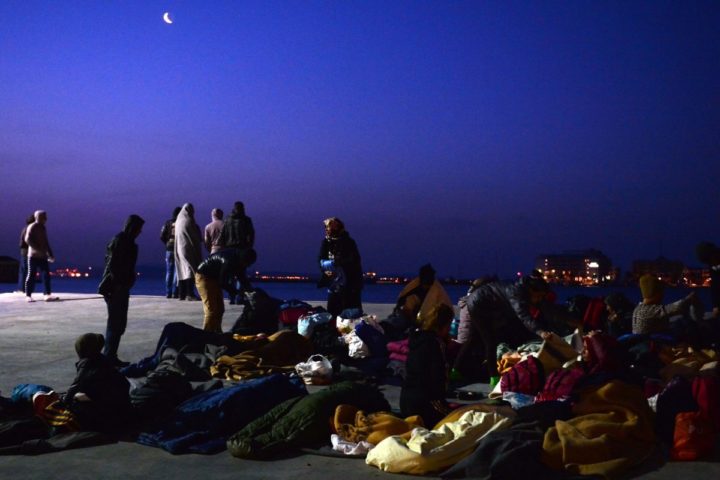 2016-04-04 06:29:35 Migrants who camp out at the port of Chios wake up on April 4, 2016. Greece sent a first wave of migrants back to Turkey on April 4 under an EU deal that has faced heavy criticism from rights groups. Under the agreement, designed to halt the main influx which comes from Turkey, all "irregular migrants" arriving since March 20 face being sent back, although the deal calls for each case to be examined individually. For every Syrian refugee returned, another Syrian refugee will be resettled from Turkey to the EU, with numbers capped at 72,000. / AFP PHOTO / LOUISA GOULIAMAKI