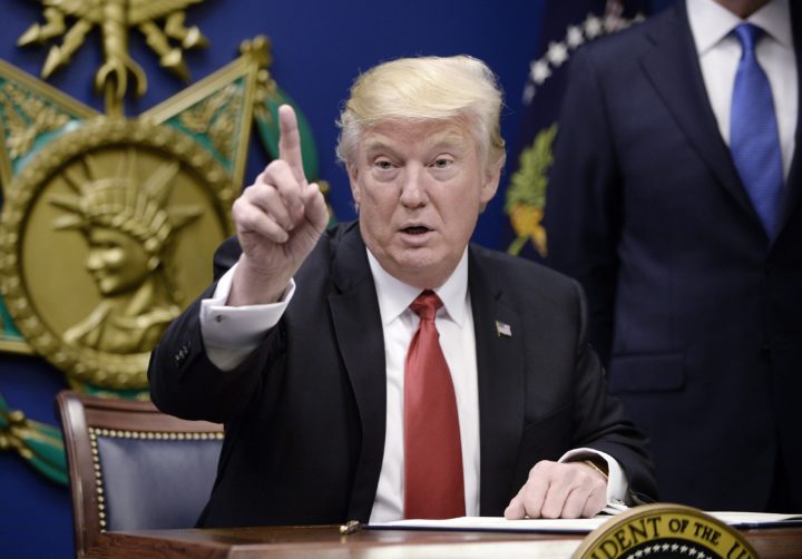 2017-01-27 13:45:05 epa05755635 US President Donald Trump gestures during the signing of Executive Orders in the Hall of Heroes at the Pentagon in Arlington, Virginia, USA, 27 January 2017. EPA/OLIVIER DOULIERY / POOL